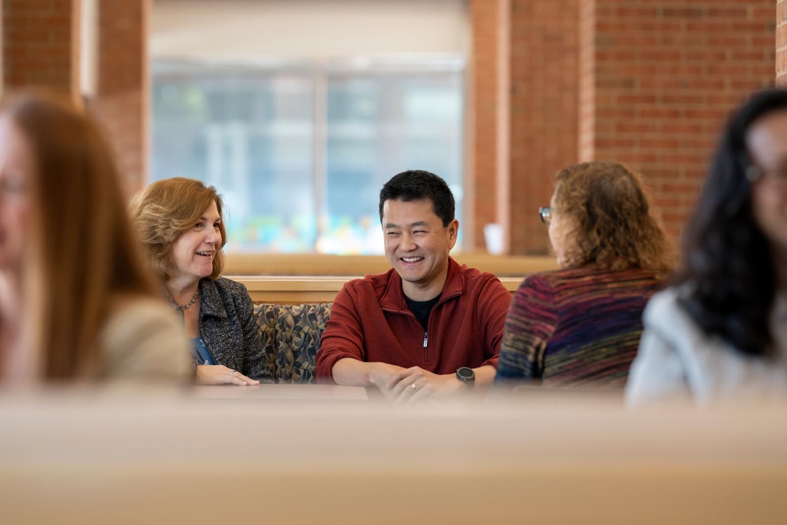 people smiling and talking