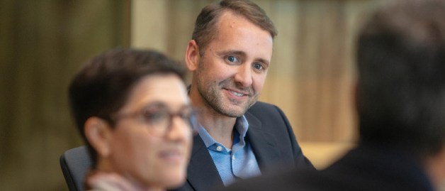 three people meeting in a meeting room