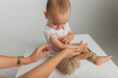 a child has a first aid plater on the harm